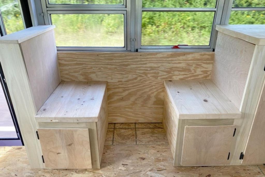 Benches in the old school bus for eating and storage